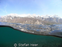A lake in the mountains of Switzerland by Stefan Heer 